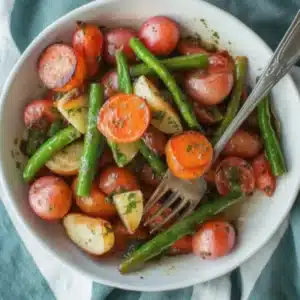 Garlic Herb Roasted Vegetables: A Year-Round Favorite for Busy Families 3 Bowl of garlic herb roasted vegetables with green beans, carrots, and red potatoes