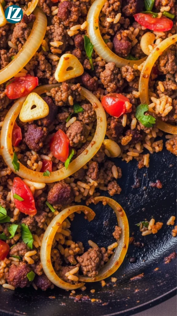 Beef And Chorizo Stuffed Peppers 4 Skillet with browned beef and chorizo, onions, garlic, rice and tomatoes mixed with spices
