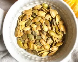 Roasted Everything Bagel Pumpkin Seeds seasoned for a crunchy, flavorful snack.