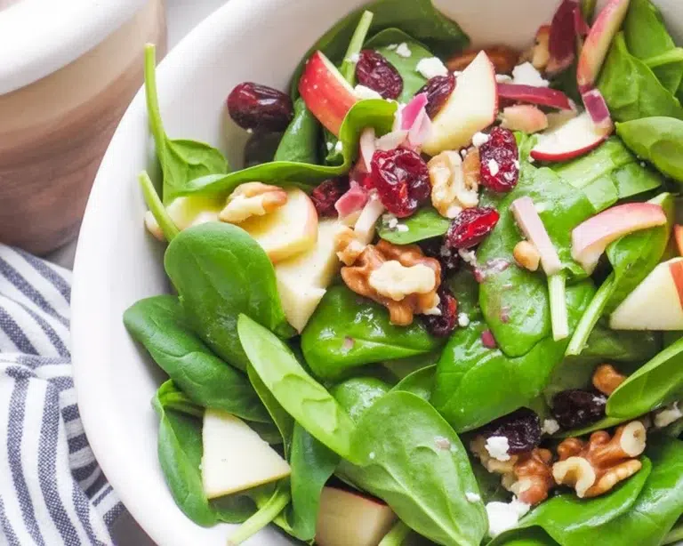 Delicious spinach and apple salad with feta and walnuts