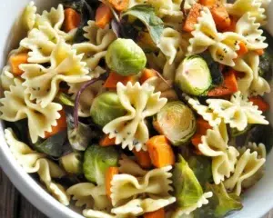 Fall Pasta Salad with roasted butternut squash, cranberries, and seasonal vegetables.