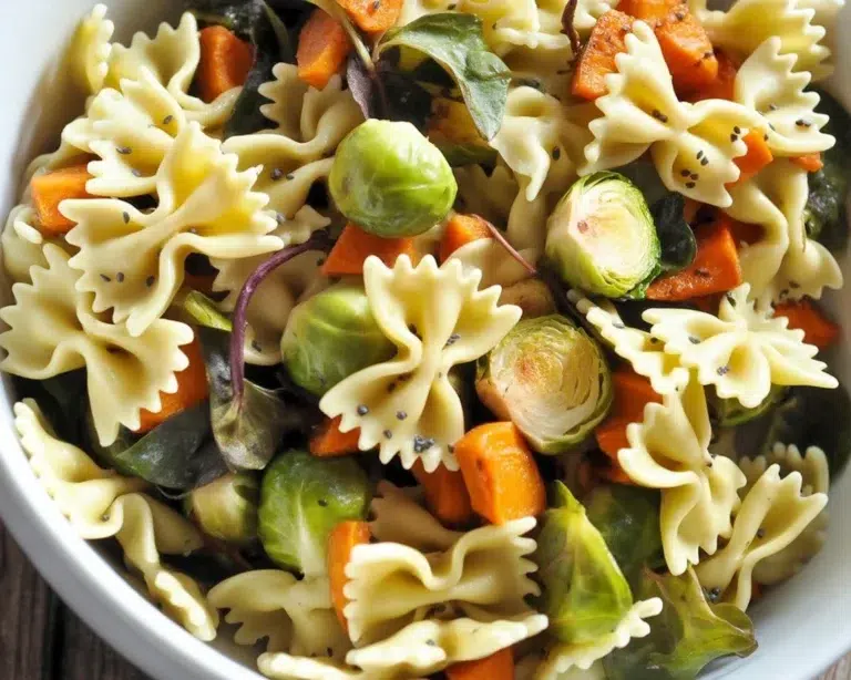 Fall Pasta Salad with roasted butternut squash, cranberries, and seasonal vegetables.