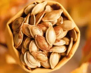 Delicious homemade cinnamon sugar pumpkin seeds, perfect for a fall snack.