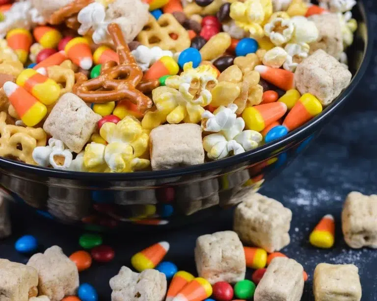Nut free Halloween trail mix with popcorn, pretzels, and candy for festive snacking.