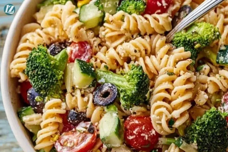 High protein pasta salad with vegetables and dressing in a bowl