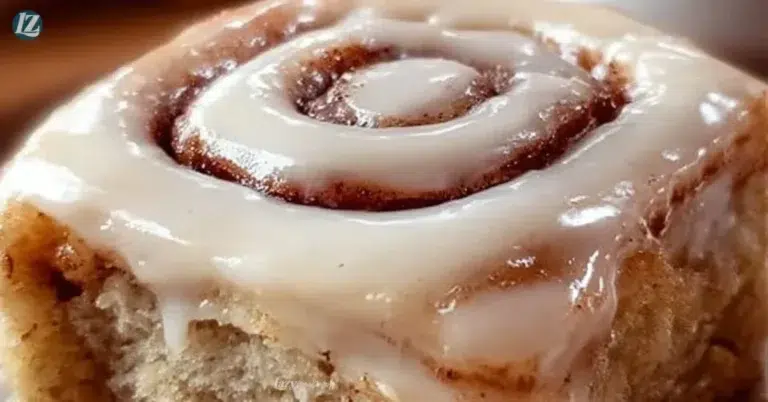 Delicious Cinnamon Roll Bliss Bars topped with creamy icing and cinnamon sugar.