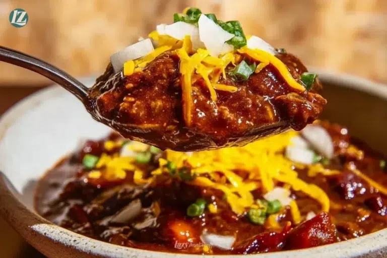 Gochujang chili dish with meat served in a bowl garnished with green onions.