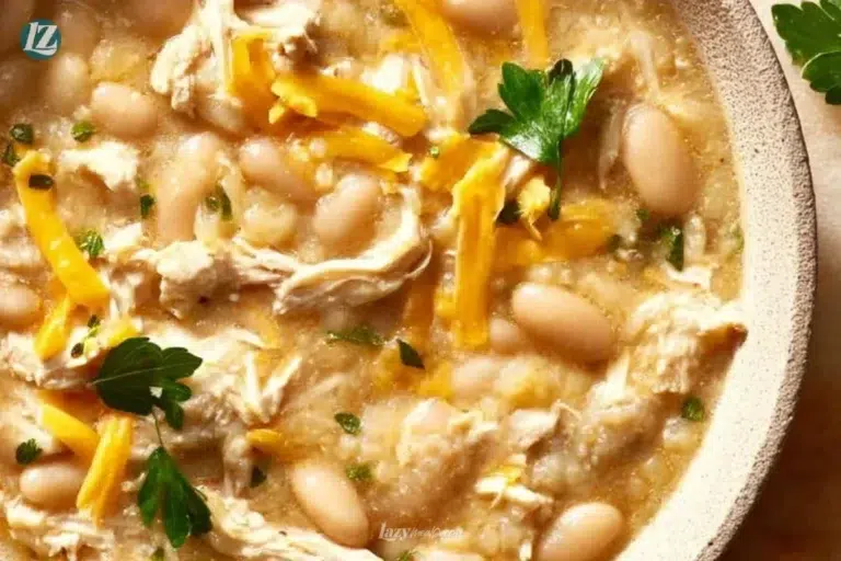 Bowl of healthy white chicken chili with fresh herbs and toppings.