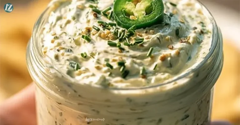 Bowl of jalapeno cream cheese dip with tortilla chips on the side