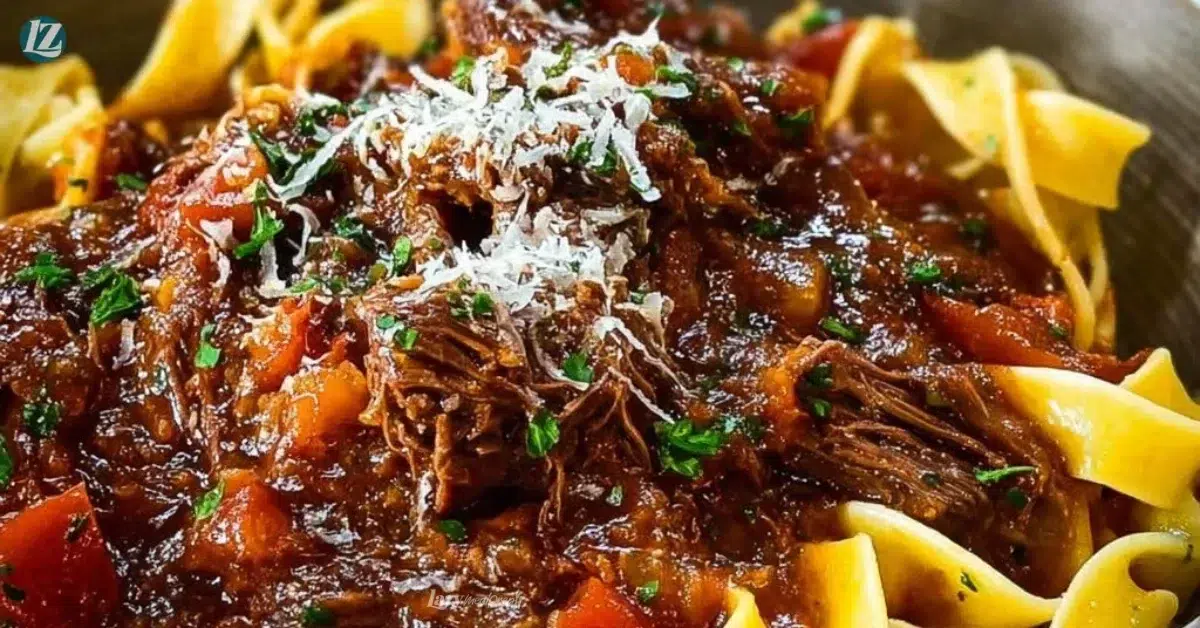 Slow cooked beef ragu served over pasta in a bowl