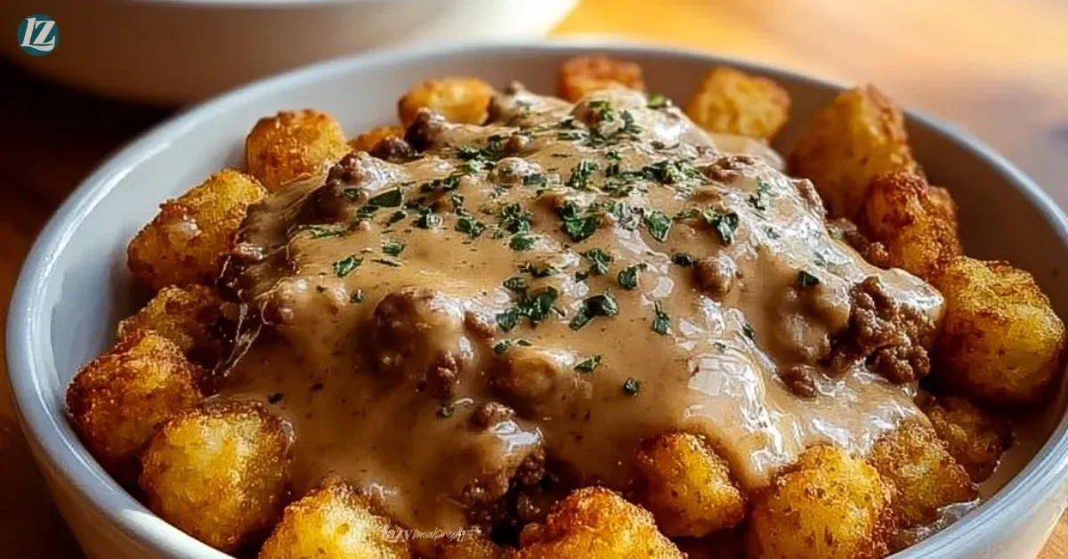 Tater Tot Breakfast Bowl topped with sausage gravy, perfect for a hearty breakfast.