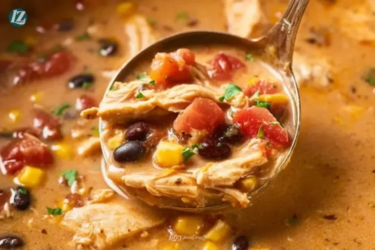 Bowl of creamy chicken taco soup topped with cheese and cilantro