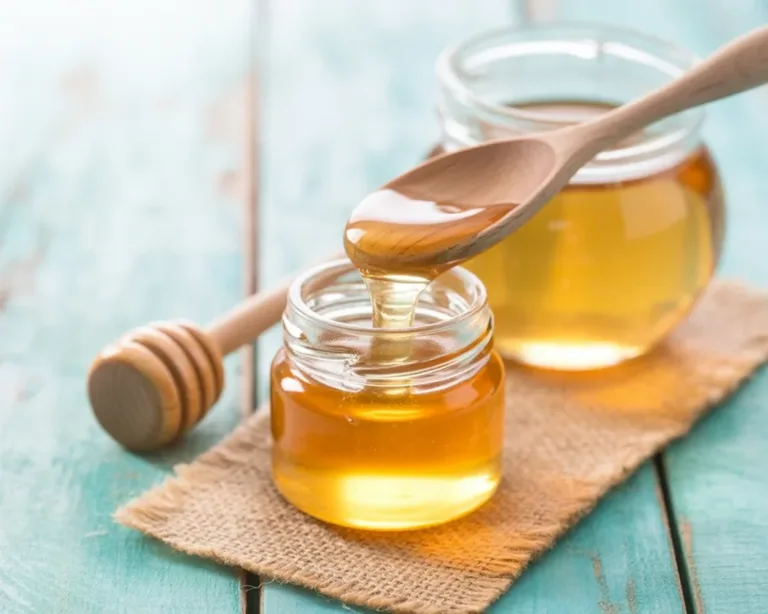 A glass of honey water representing its role in weight loss and hydration