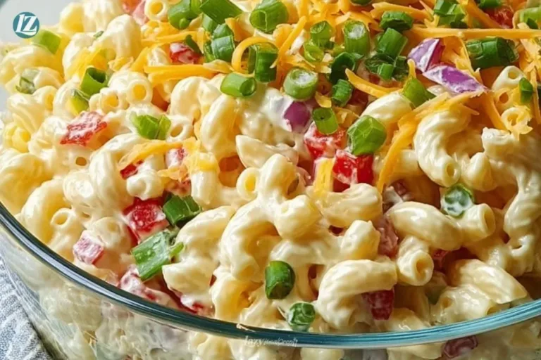 Guy Fieri's vibrant and flavorful macaroni salad garnished with fresh vegetables.