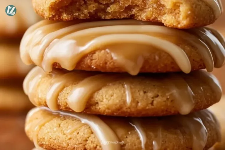 Delicious maple cookies drizzled with brown butter icing on a plate