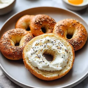 Homemade almond flour bagels topped with sesame seeds and fresh herbs.