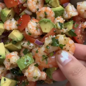 Vibrant Cinco de Mayo shrimp salad with fresh vegetables and seasonings.