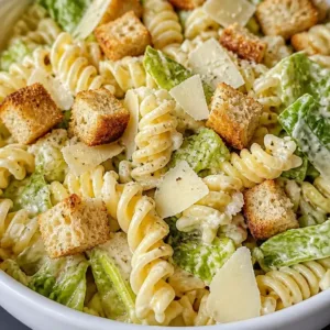 Delicious Chicken Caesar Pasta Salad garnished and ready to serve.