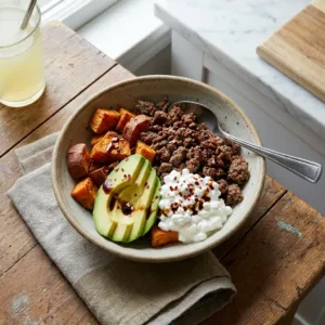 Hot Honey Ground Beef Bowls served in a colorful dish with fresh toppings
