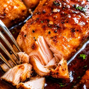 Delicious salmon recipe featuring honey garlic glaze and vibrant accompaniments.